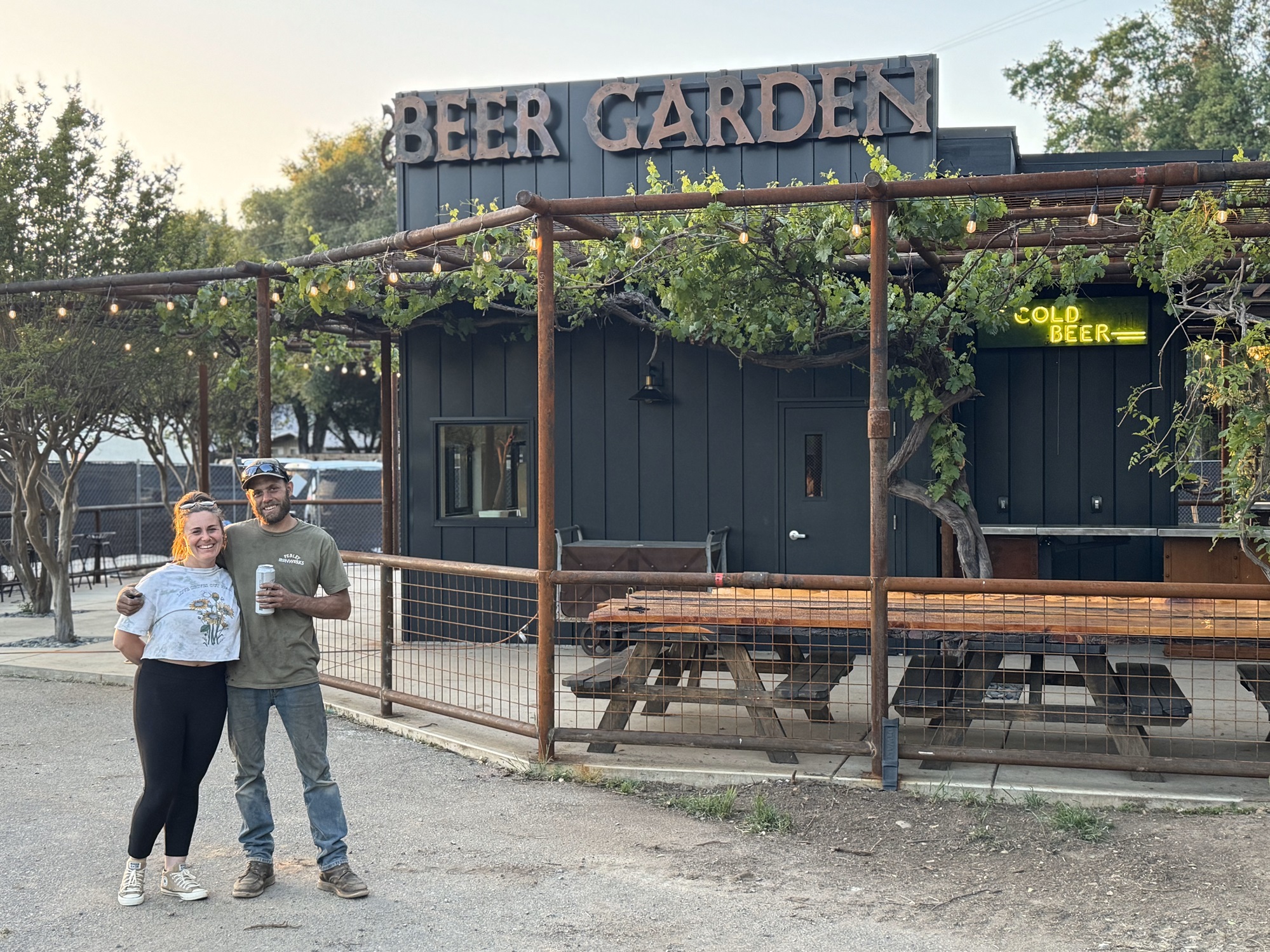 couple in front of sign